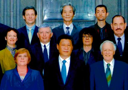 Rose Oliver (wearing green) with Xi Jinping and other dignitaries in 2014