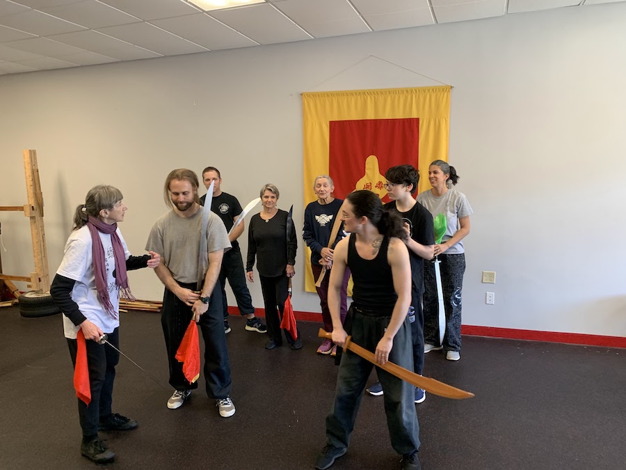 Gabe runs the workshop with the engaged students at Thundering Wave Martial Arts!