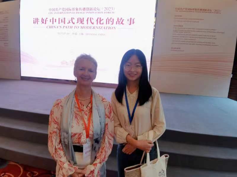 With young Shanghai University student and our "guide" for the conference and interview with the Beijing Review!