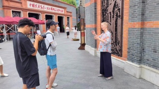 Rose being interviewed at the 'Site of the 1st CCPC National Congress Museum'